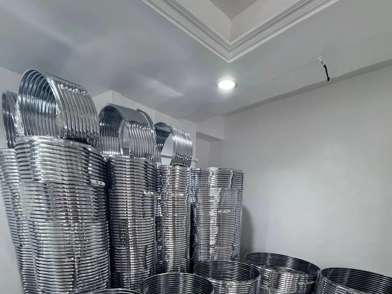 Chrome drum rings stacked in the Trybox stockroom